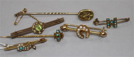 An 18ct gold and seed pearl bar brooch, a 9ct bar brooch, two other yellow metal bar brooches and two stick pins.